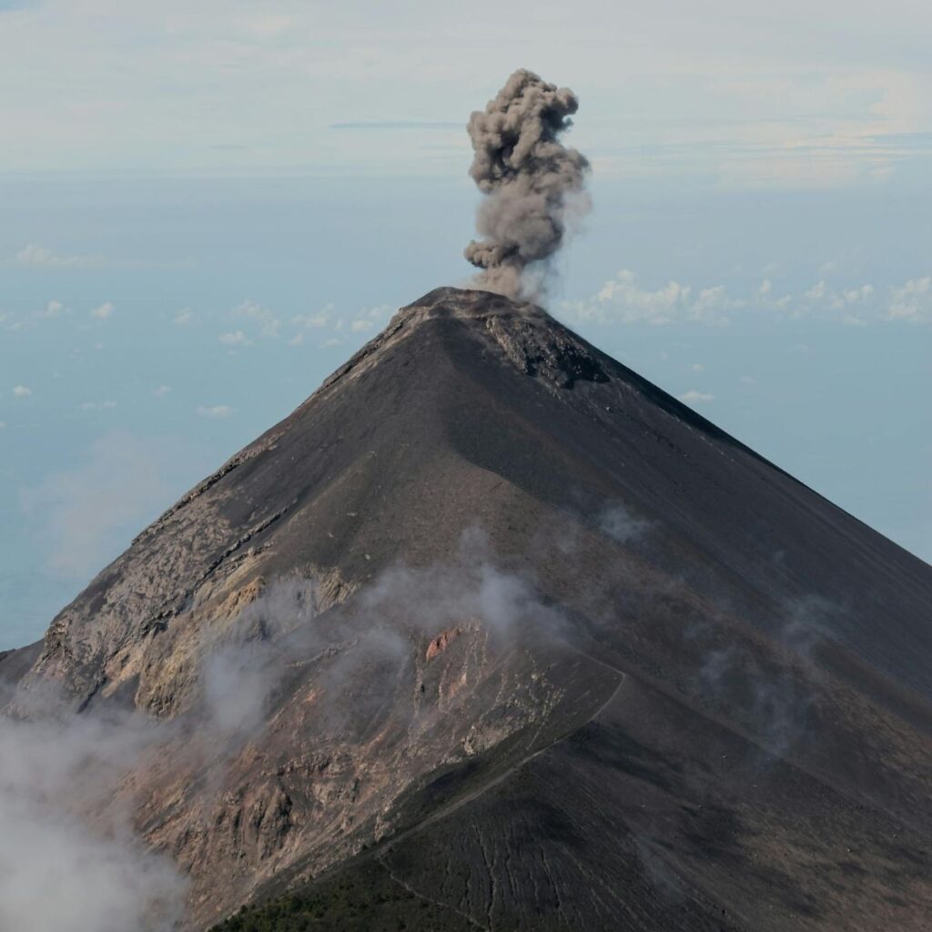 Volcán de Fuego erupting with ash plume in Guatemala highlighting the volcanic terroir influencing coffee cultivation