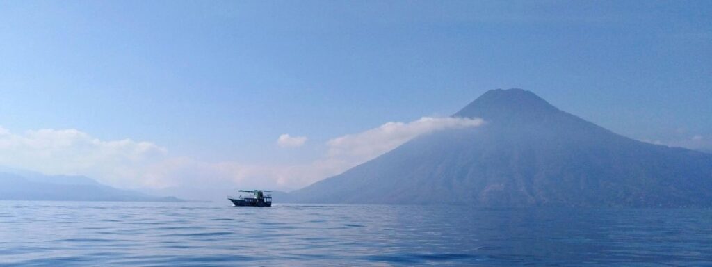 Scenic view of Lake Atitlan in Guatemala, showcasing the beautiful volcanic landscape where the Best Guatemalan Coffee Beans are cultivated.