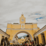 Santa Catalina Arch in Antigua Guatemala showcasing the historic atmosphere behind the Antigua vs Huehuetenango coffee comparison